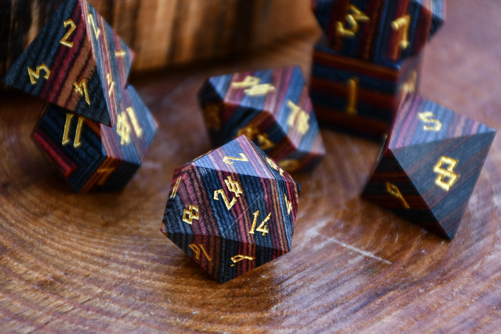 colorful striped polyhedral wood dice for dungeons and dragons