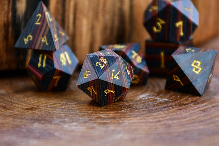 colorful striped polyhedral wood dice for dungeons and dragons