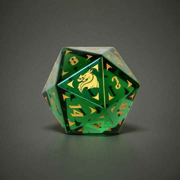 Green glass d20 dnd die with gold numbers and dragon