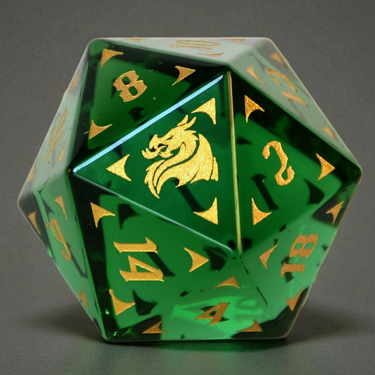 Green glass d20 dnd die with gold numbers and dragon