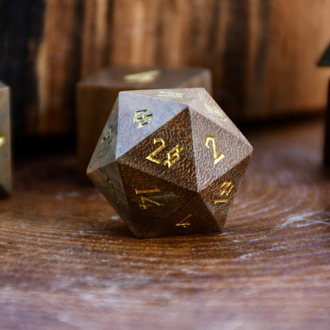 Set of polyhedral wood dice on a wooden surface