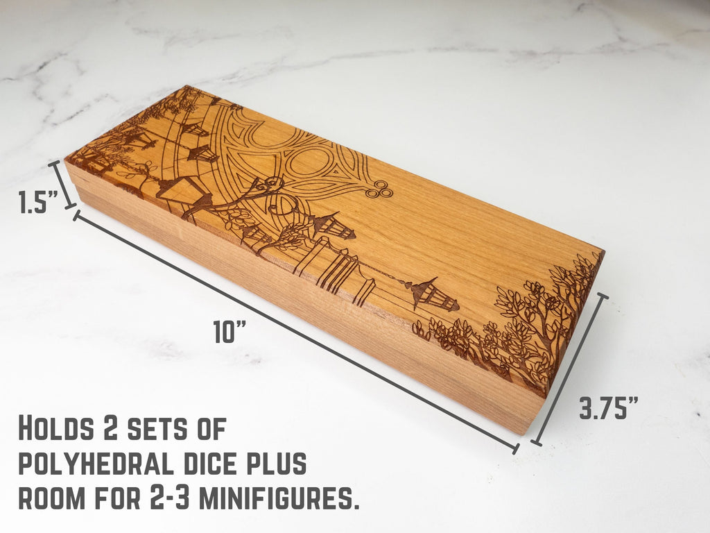 Wooden dice box with engraved design on a white marble background