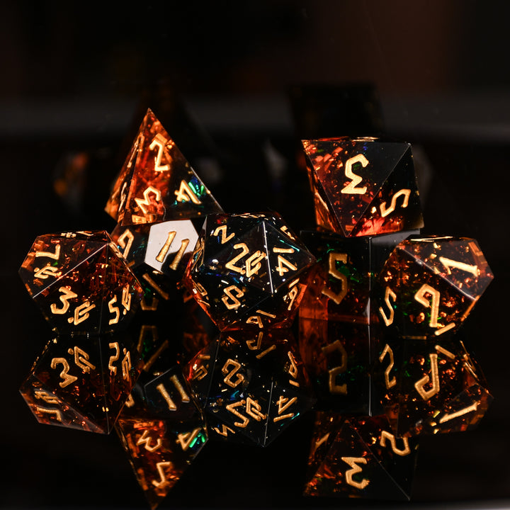 Hellish Rebuke Sharp-Edged Resin Dice with themes of red and orange, gold numbering and metallic foil inside for ttrpg and dnd