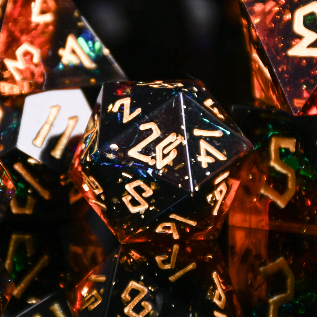 Hellish Rebuke Sharp-Edged Resin Dice with themes of red and orange, gold numbering and metallic foil inside for ttrpg and dnd