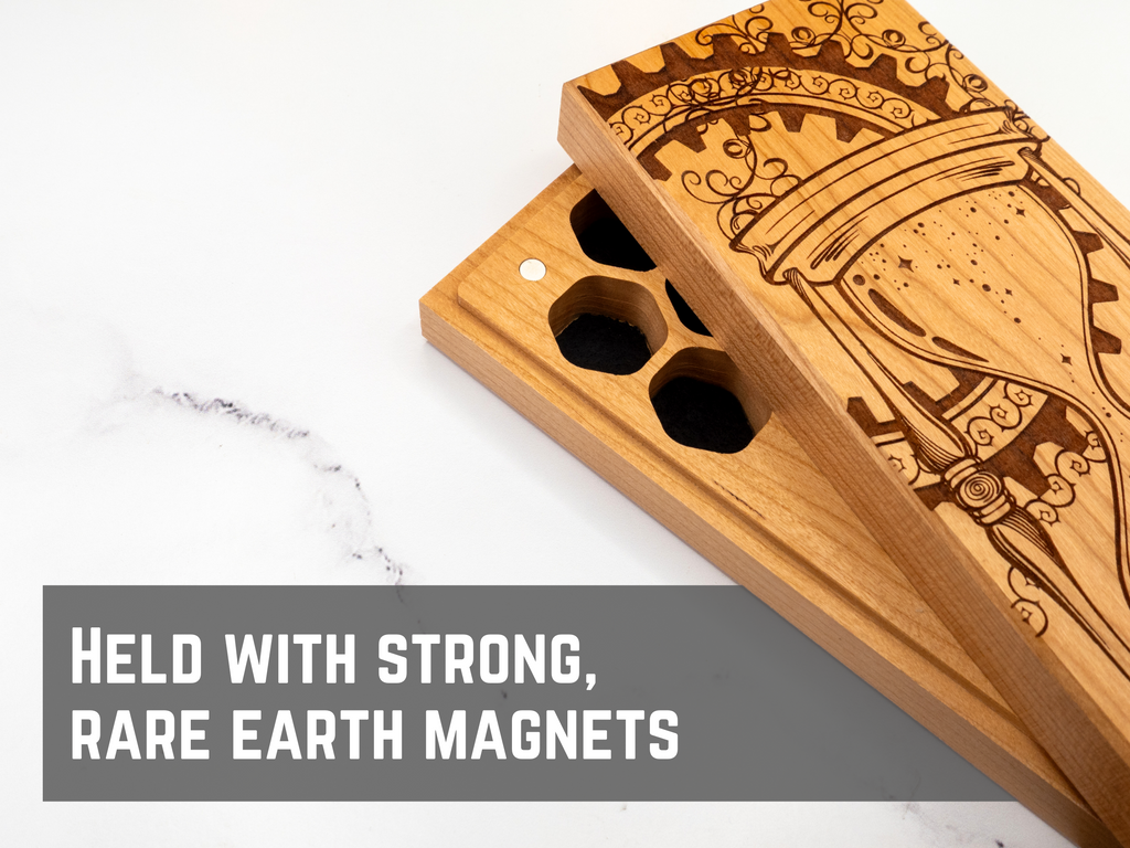 Wooden dnd dice vault with engraved design on a marble surface, text 'Held with strong, rare earth magnets' below.