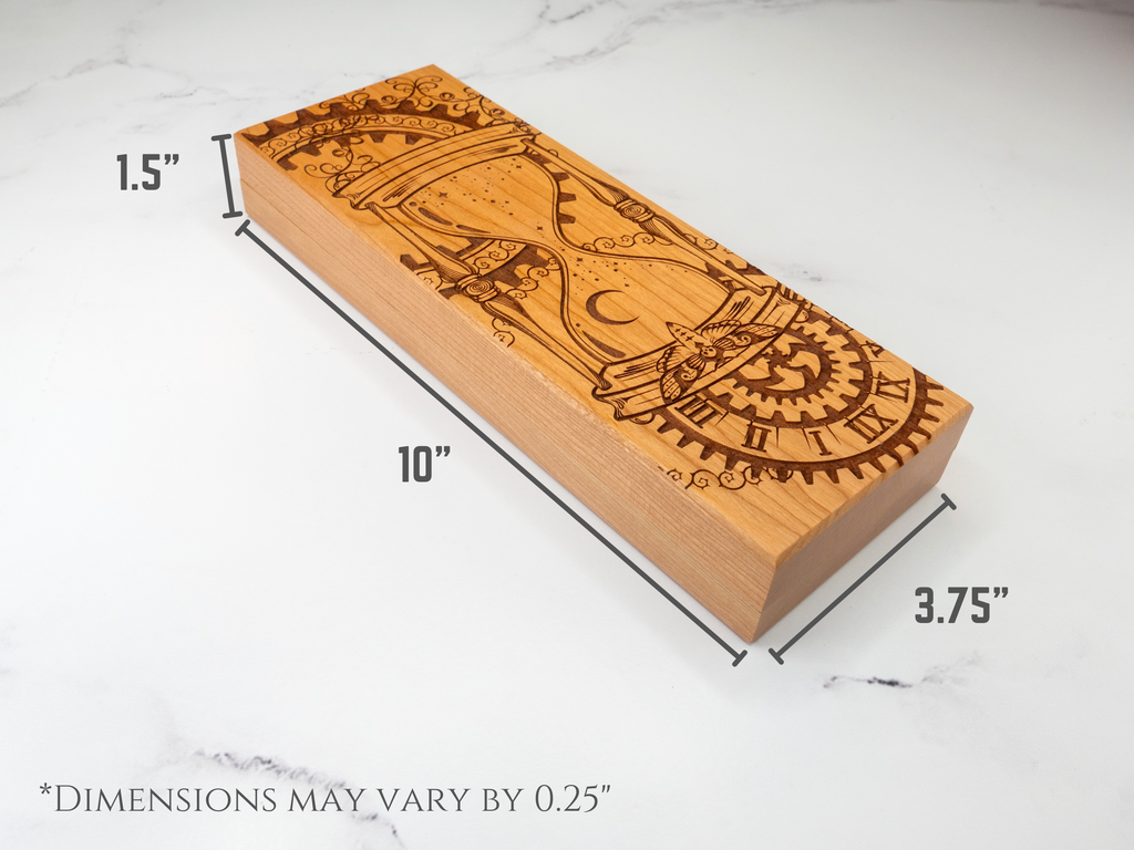 Wooden dice vault with engraved design and measurements on a white marble background
