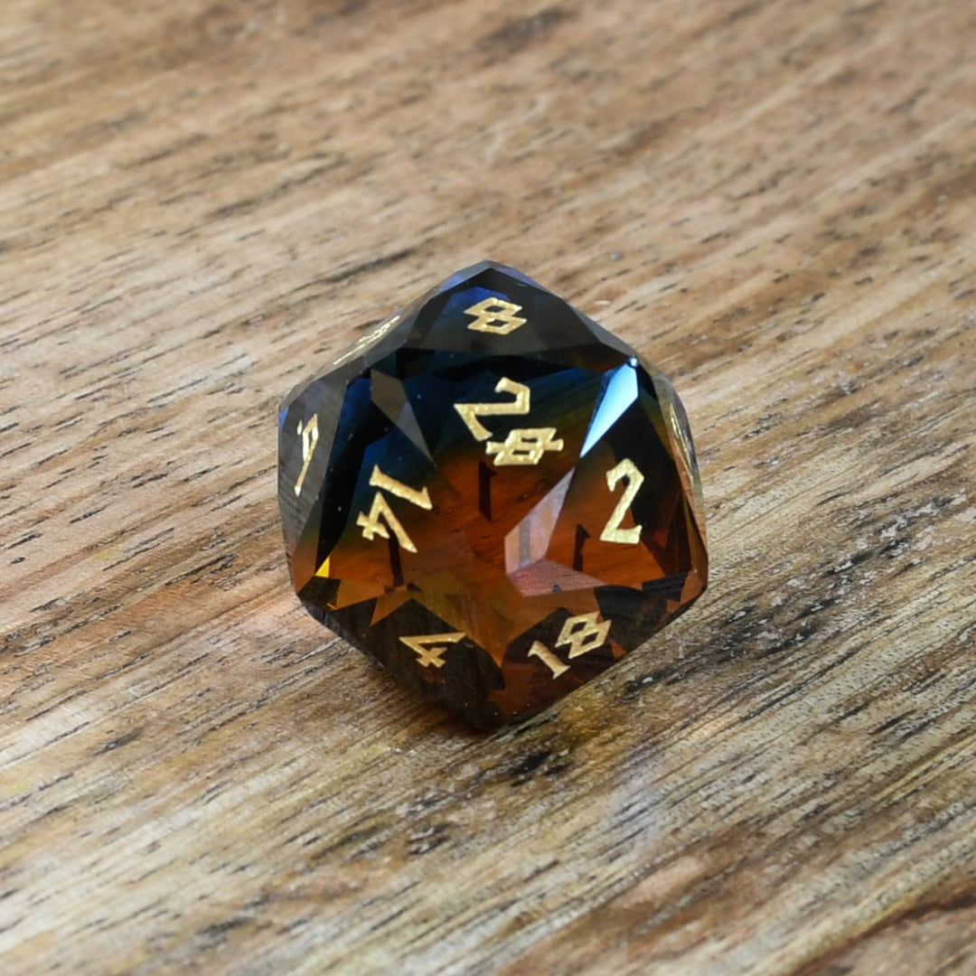 blue and orange glass multifaceted dnd d20 die