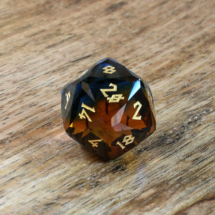 blue and orange glass multifaceted dnd d20 die