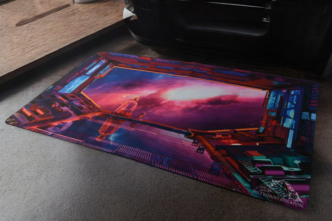 A rectangular gaming playmat featuring a space-themed design with a character looking out into space.