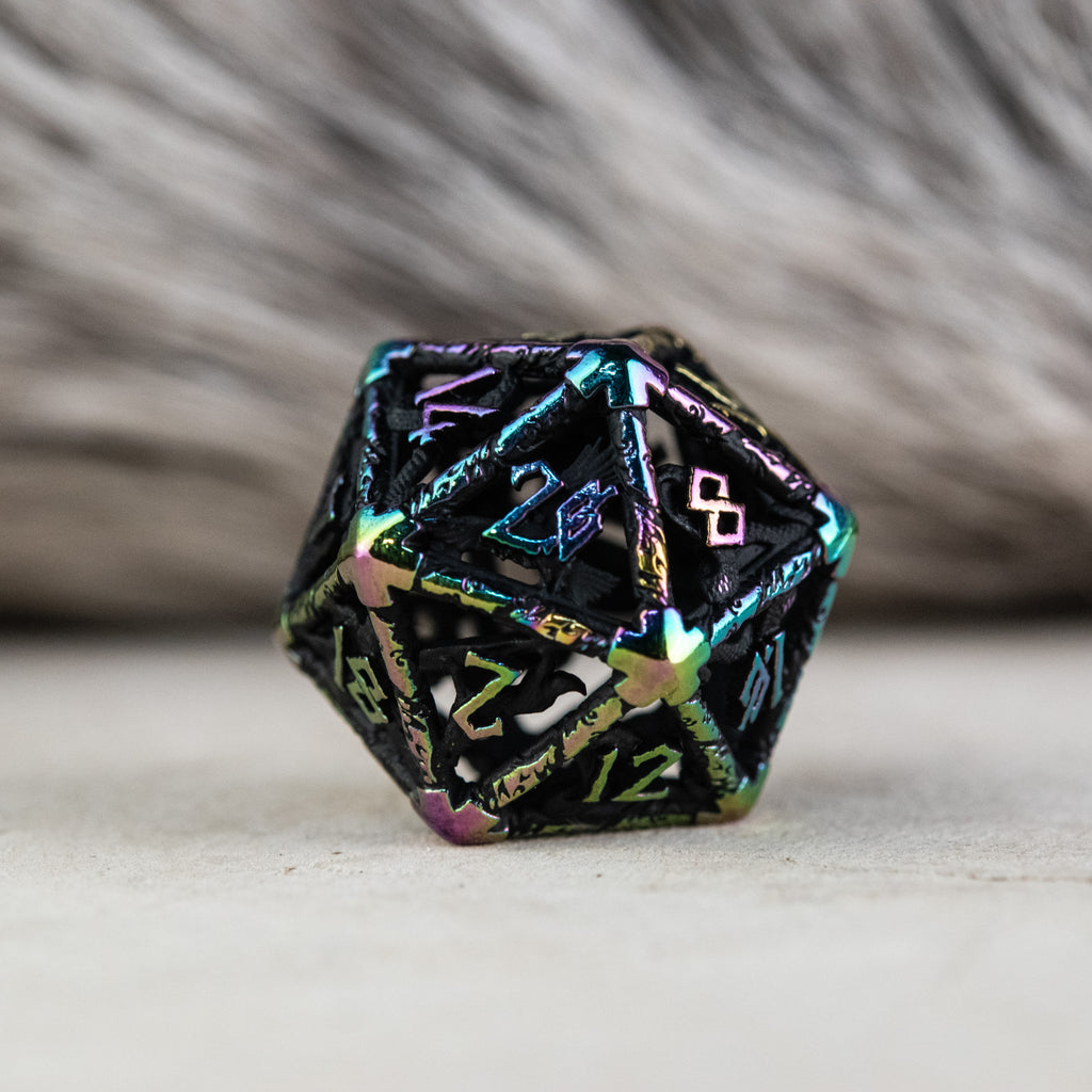 A set of black and iridescent hollow metal dice with embossed numbers, including various shapes commonly used in RPGs.