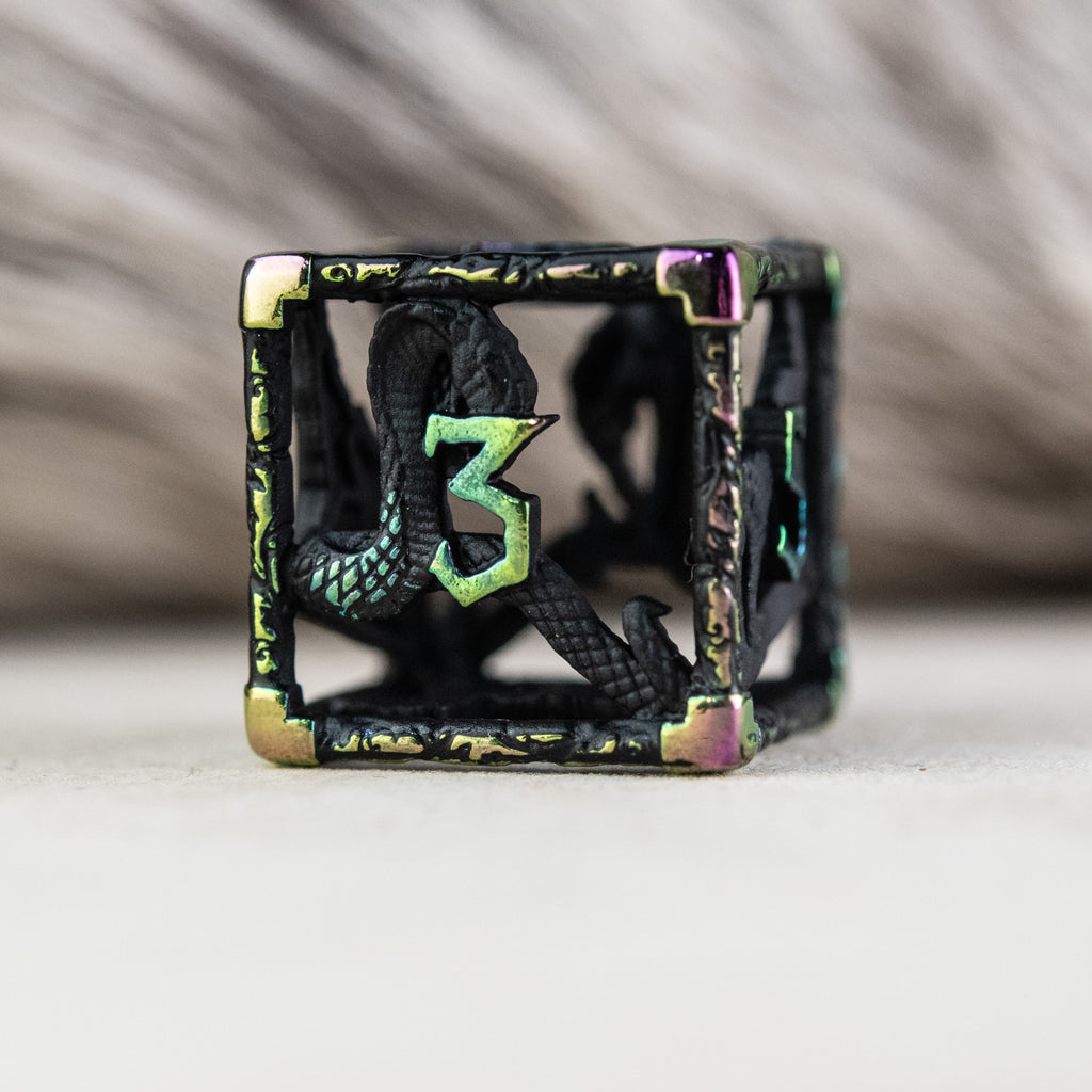 A set of black and iridescent hollow metal dice with embossed numbers, including various shapes commonly used in RPGs.