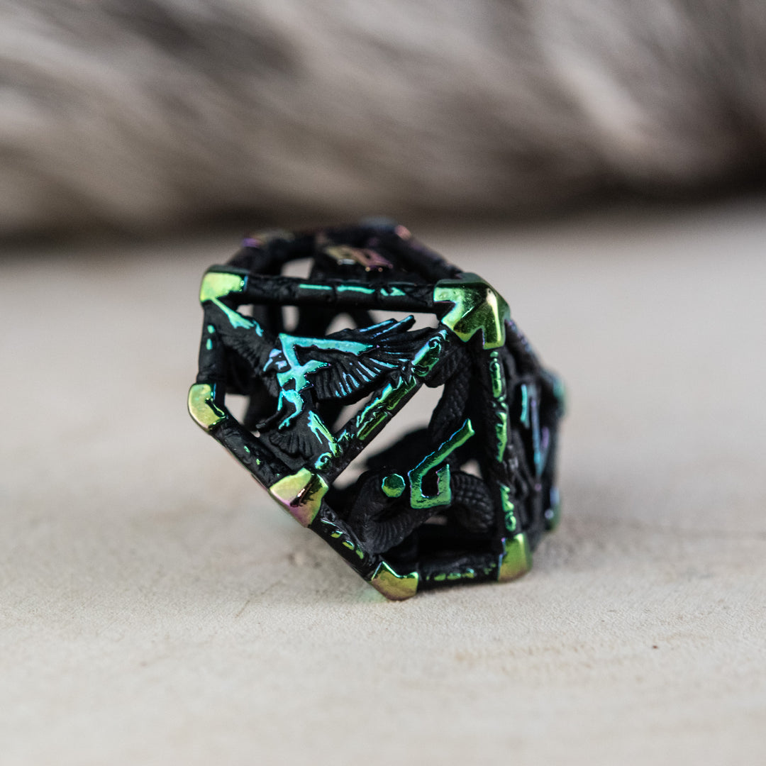 A set of black and iridescent hollow metal dice with embossed numbers, including various shapes commonly used in RPGs.
