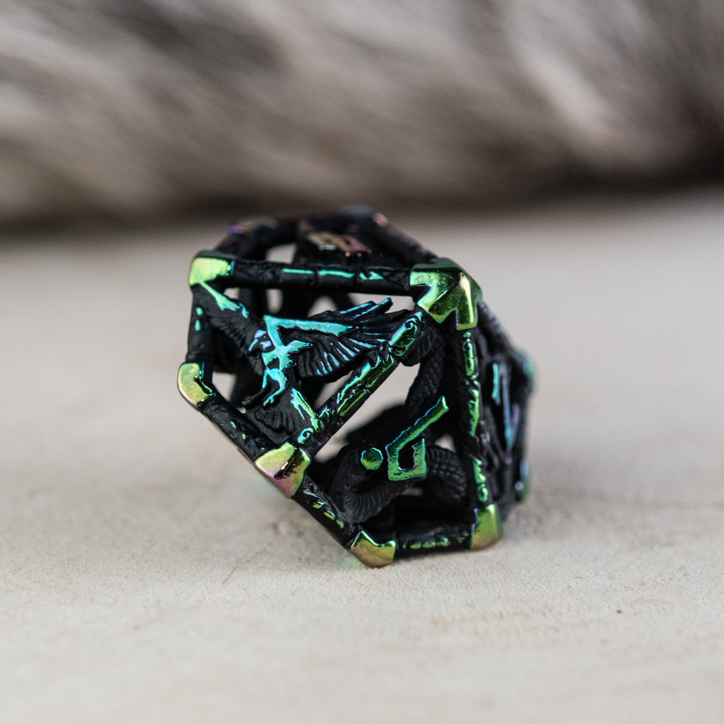 A set of black and iridescent hollow metal dice with embossed numbers, including various shapes commonly used in RPGs.