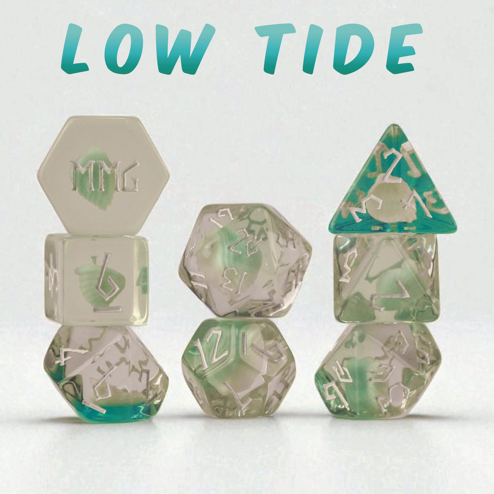 Set of green, blue and clear resin dice with 'Misty Mountain Gaming' branding on a white background.