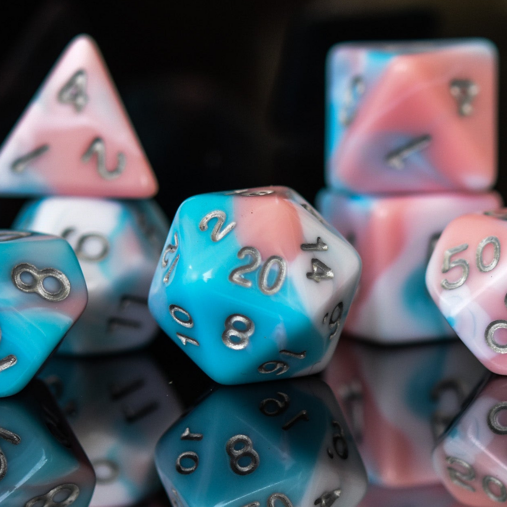 Close-up of multicolored dice with numbers on a reflective surface