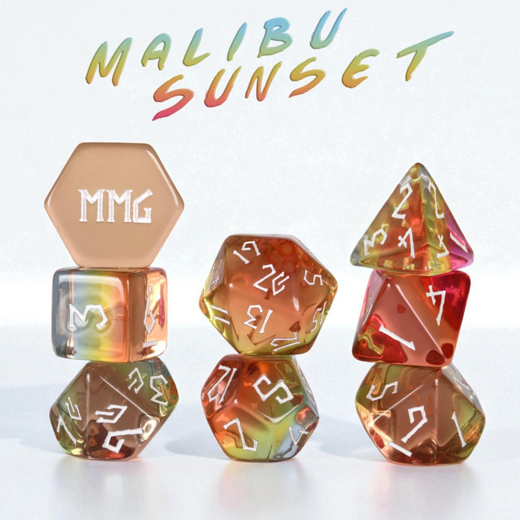 Set of colorful polyhedral dice with 'MMG' branding on a white background, labeled 'Malibu Sunset'.