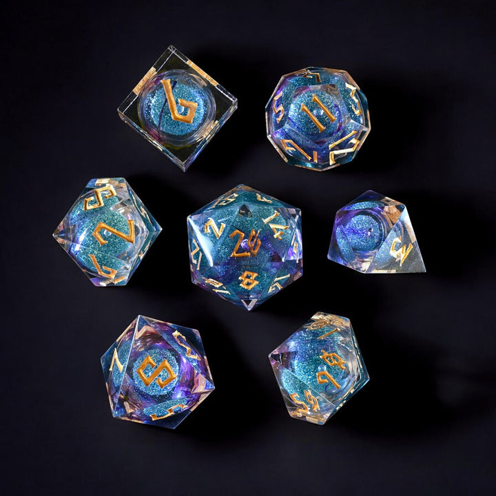 A set of resin liquid core dice with purple and blue glitter, hand-crafted and painted with engraved numbers for tabletop RPG games.
