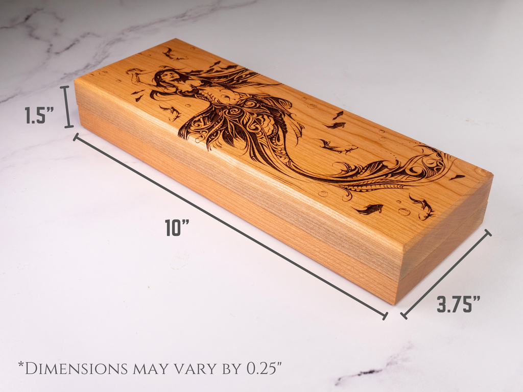 Wooden dice vault with engraved design on a marble surface