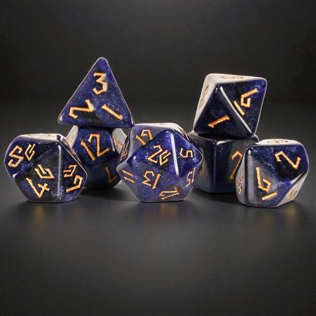 Blue polyhedral dice with gold numbers on a black background