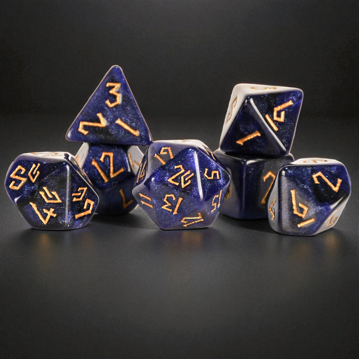 Blue polyhedral dice with gold numbers on a black background