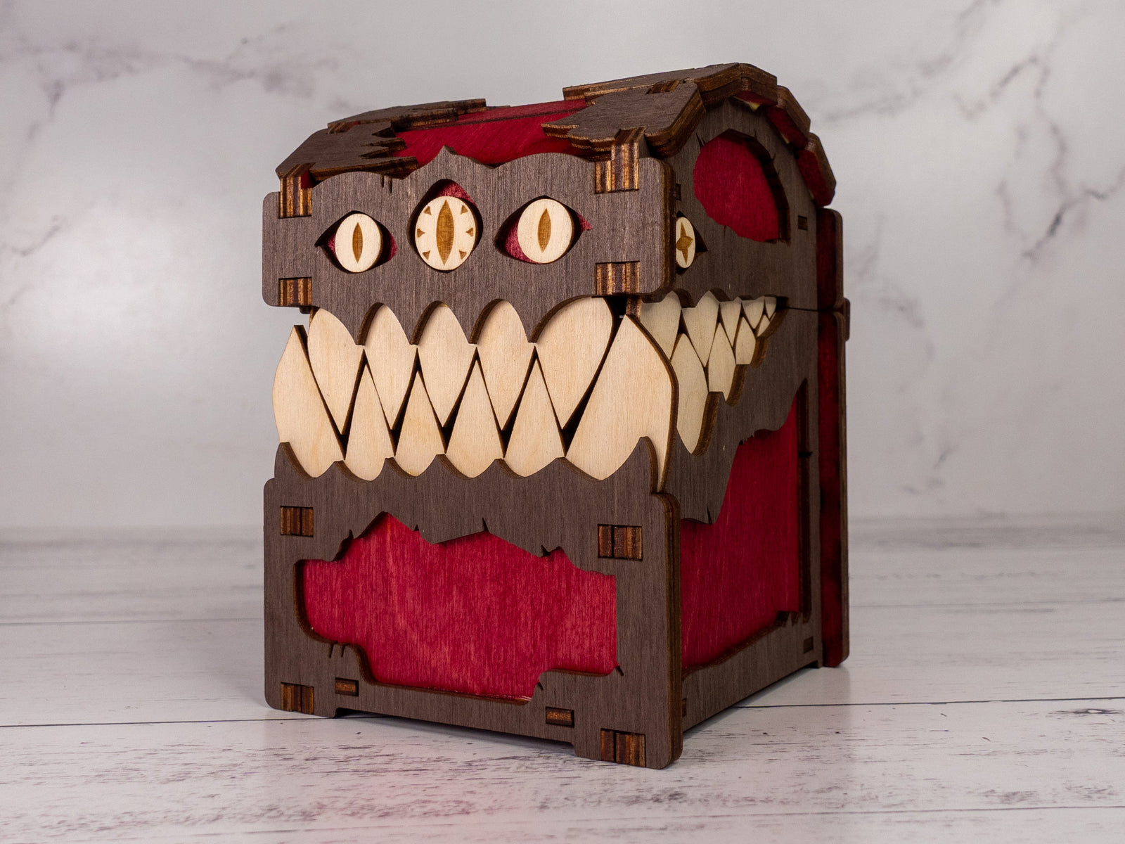 Wooden toy with a monster design on a marble background