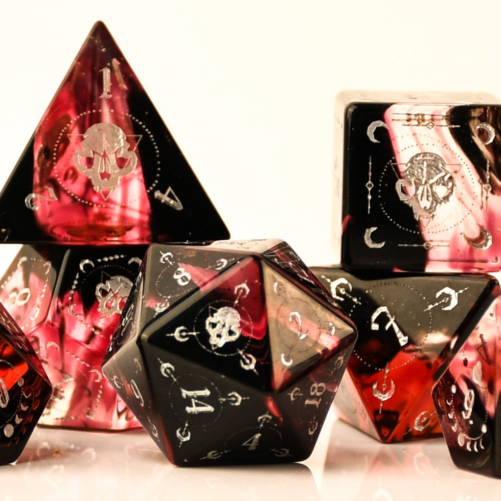 Set of polyhedral dice with red and black design on a white background