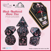 Black shattered glass dice set with packaging on a pink background, featuring Misty Mountain Gaming logos.