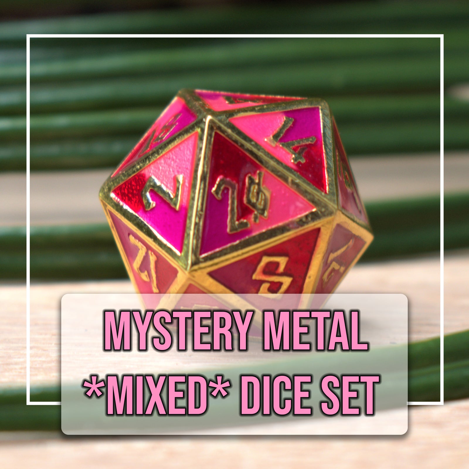 A close-up of a pink-colored die with gold numbering, part of a mystery metal dice set.