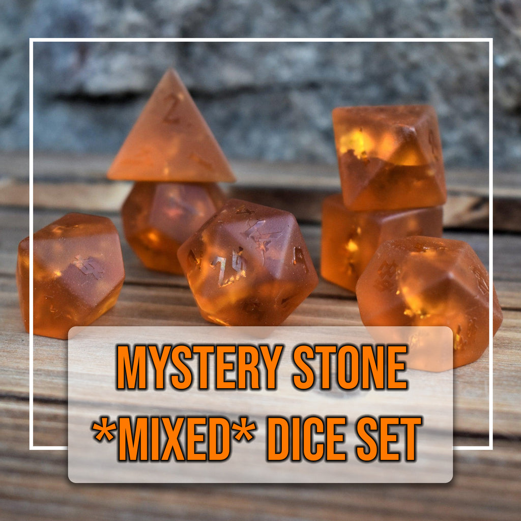 A set of translucent orange gemstone dice with engraved numbers, displayed on a wooden surface.