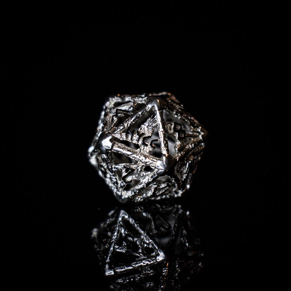 metallic polyhedral hollow dice with 'NYCC' branding on a black background