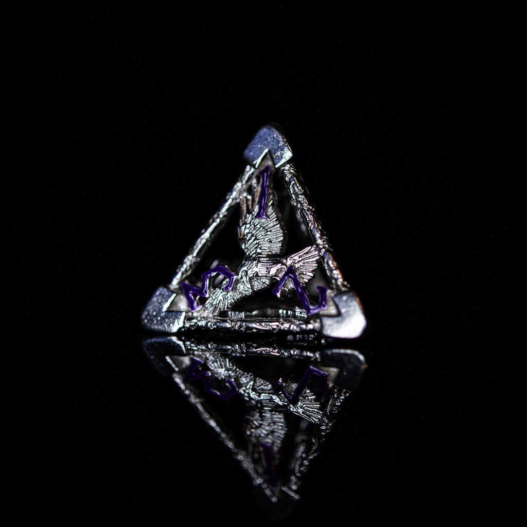 A set of sterling silver hollow dice with purple embossed numbers, displayed on a reflective surface.