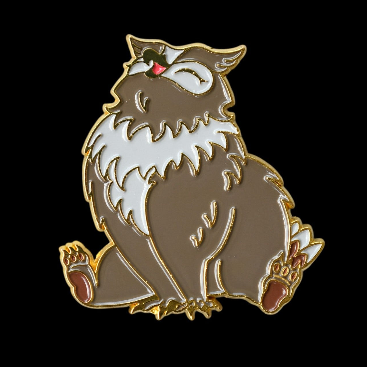 Owl-bear pin on a black background
