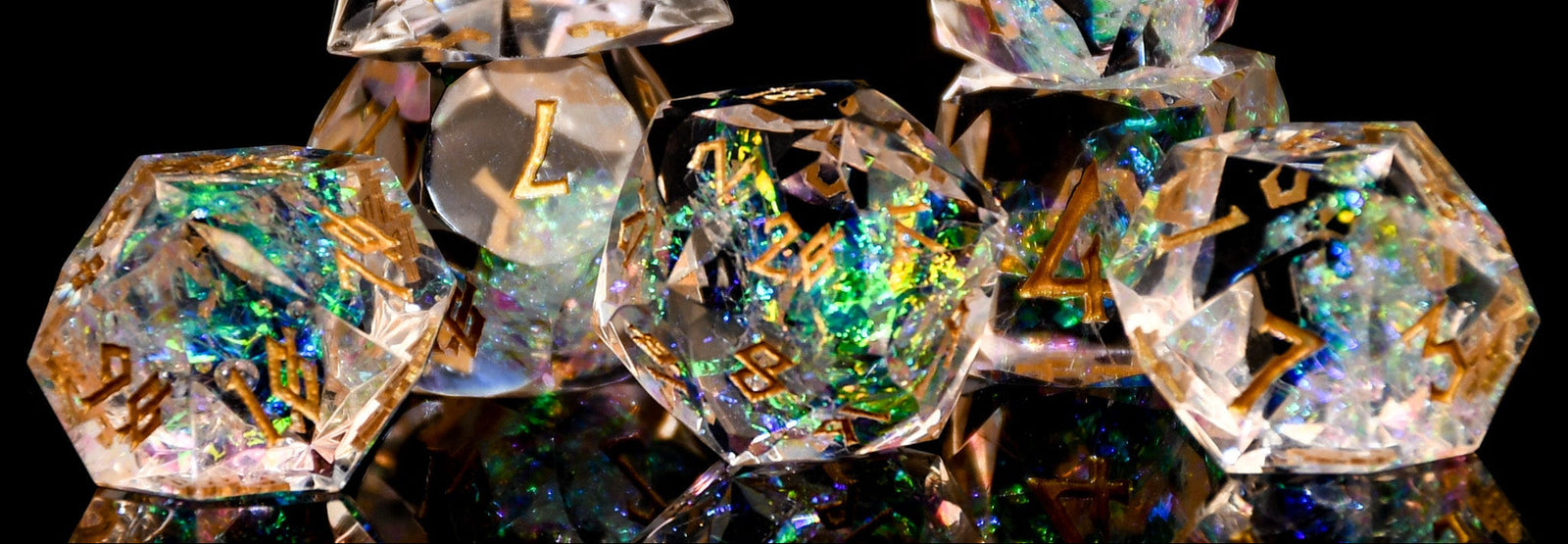 Set of crystal dice with metallic sheen on a black background