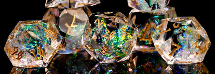 Set of crystal dice with metallic sheen on a black background