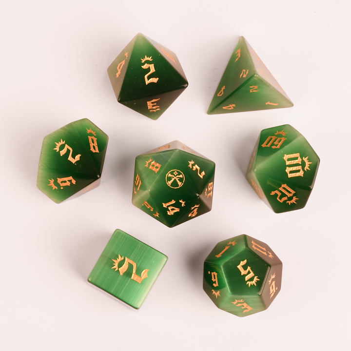 Set of Pathfinder dice with gold numbers on a fantasy-themed background