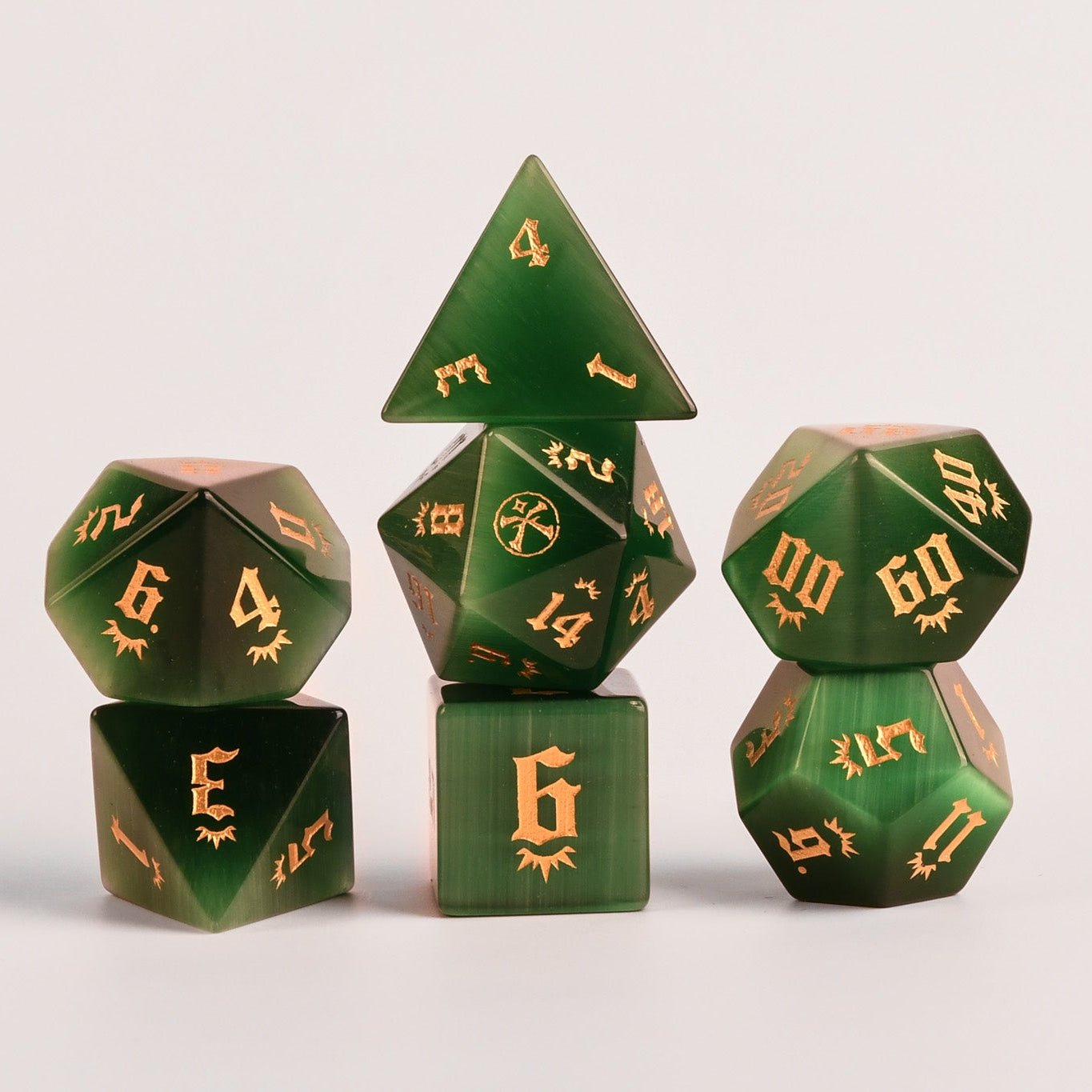 Set of Pathfinder dice with gold numbers on a fantasy-themed background
