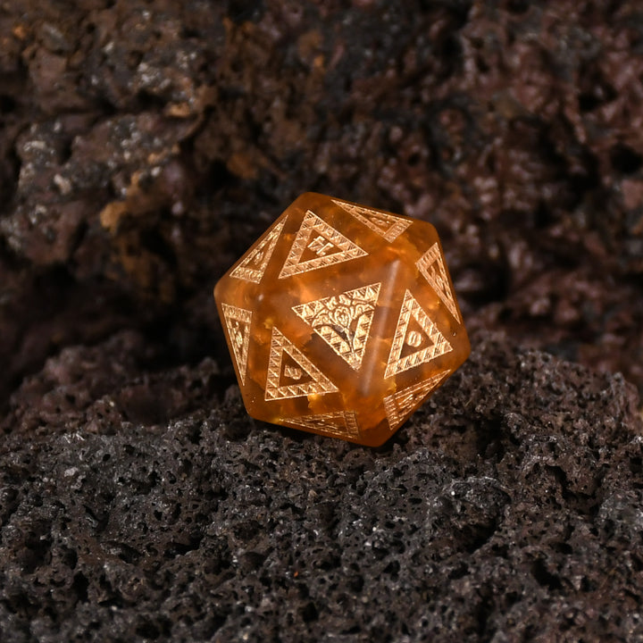 A set of Polynesian Lava Glass dice with Polynesian designs engraved on them.