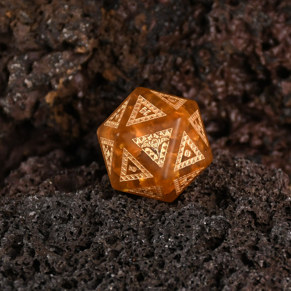 A set of Polynesian Lava Glass dice with Polynesian designs engraved on them.