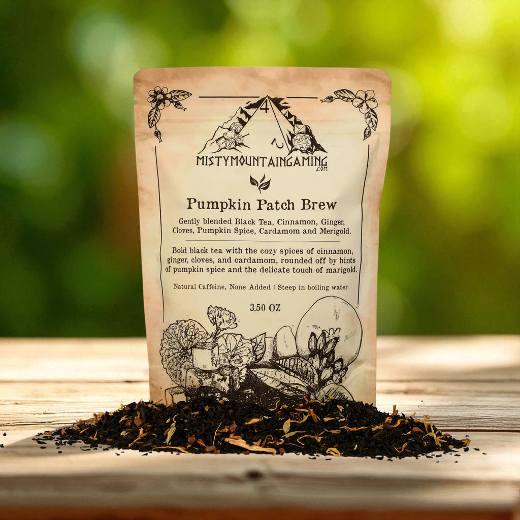 Tea bag labeled 'Pumpkin Patch Brew' from Misty Mountain Gaming with loose tea on a wooden surface.