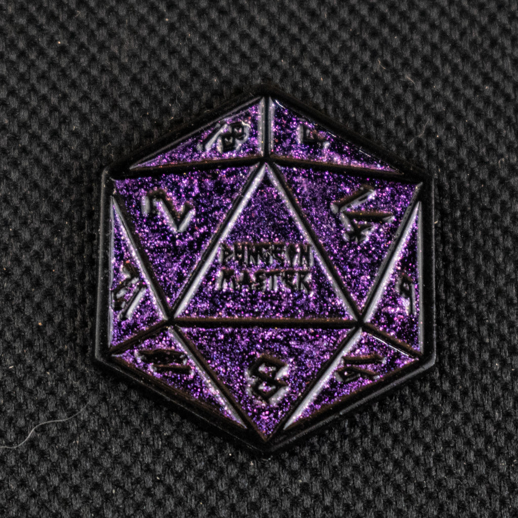 One purple glitter d20 dice pin on a dark background