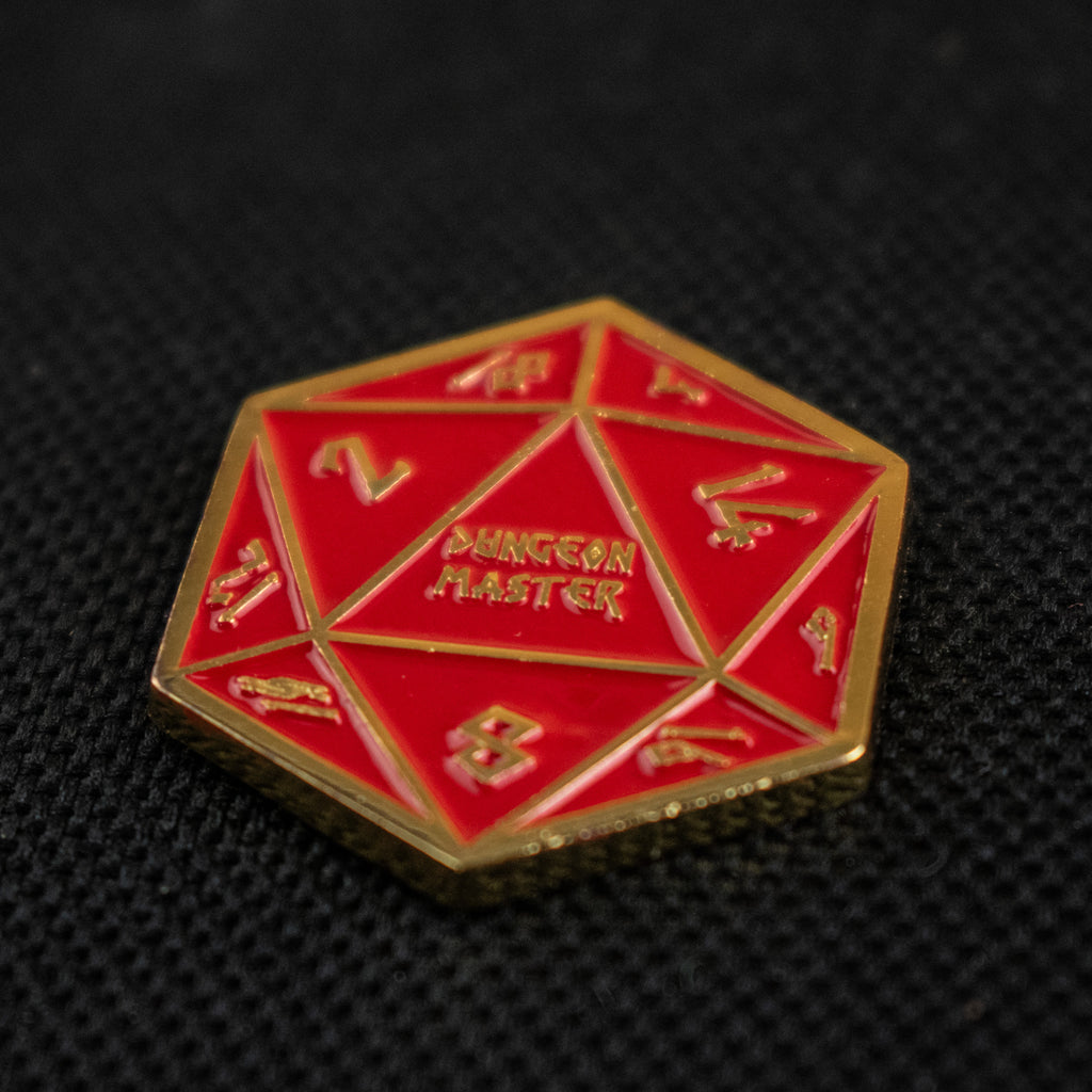 Red polyhedral d20 with gold border on a black background