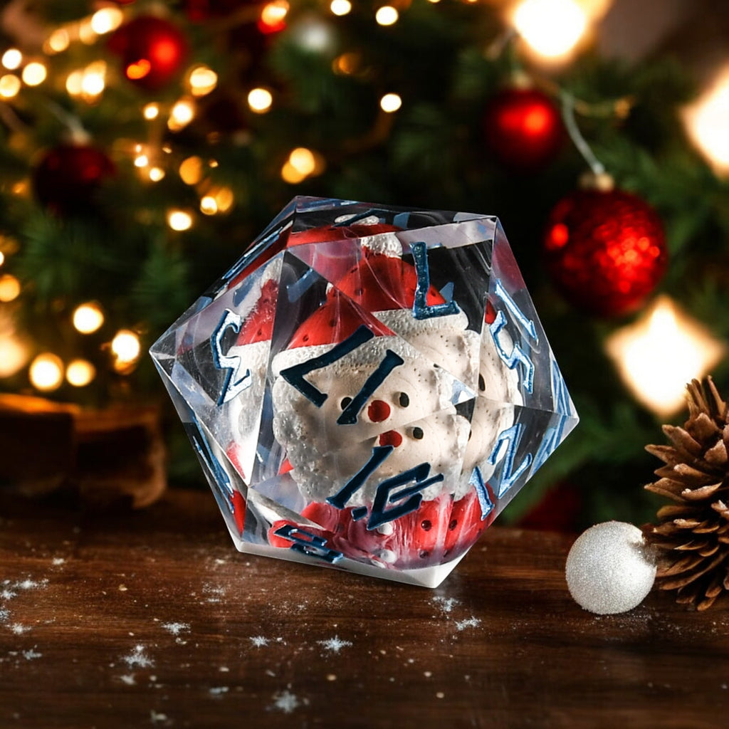 Clear resin 50mm d20 die with santa inside and blue numbering in a christmas scene