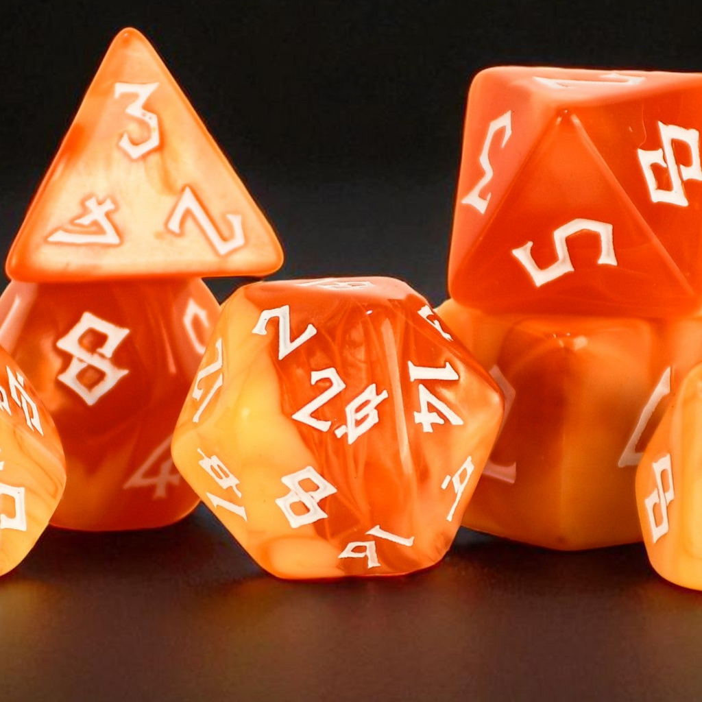 Set of orange polyhedral dice with white numbering on a dark background