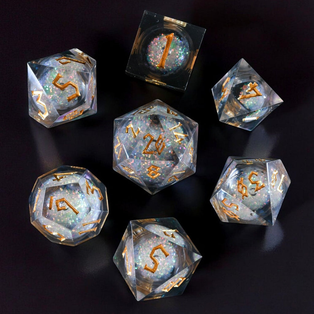 A set of resin liquid core dice with a liquid core, featuring floating glitter and engraved numbers, in various shapes including a d4, d6, d8, d10, d12, and d20.