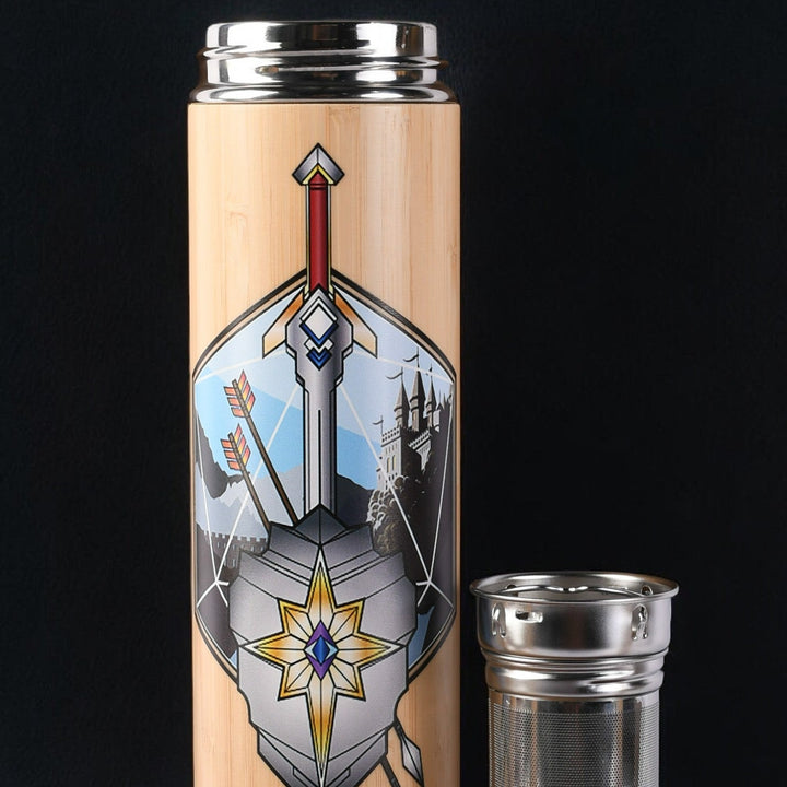 travel mug with decorative emblem and metal tea diffuser