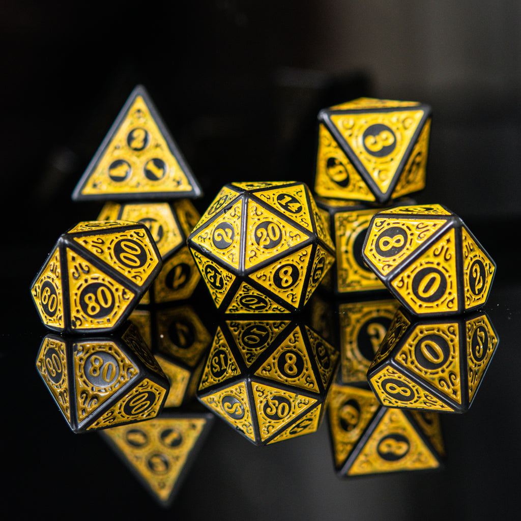 A set of yellow acrylic dice with black engravings, including various shapes such as a 4-sided, 6-sided, 8-sided, 10-sided, 12-sided, and 20-sided die, displayed against a reflective background.