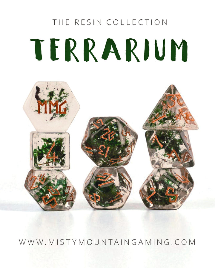Resin dnd dice with greenery and numbers on a white background, featuring the brand &