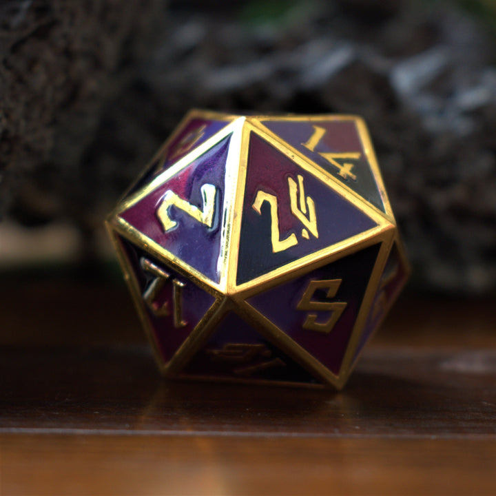A large, metallic purple D20 dice with embossed gold numbers