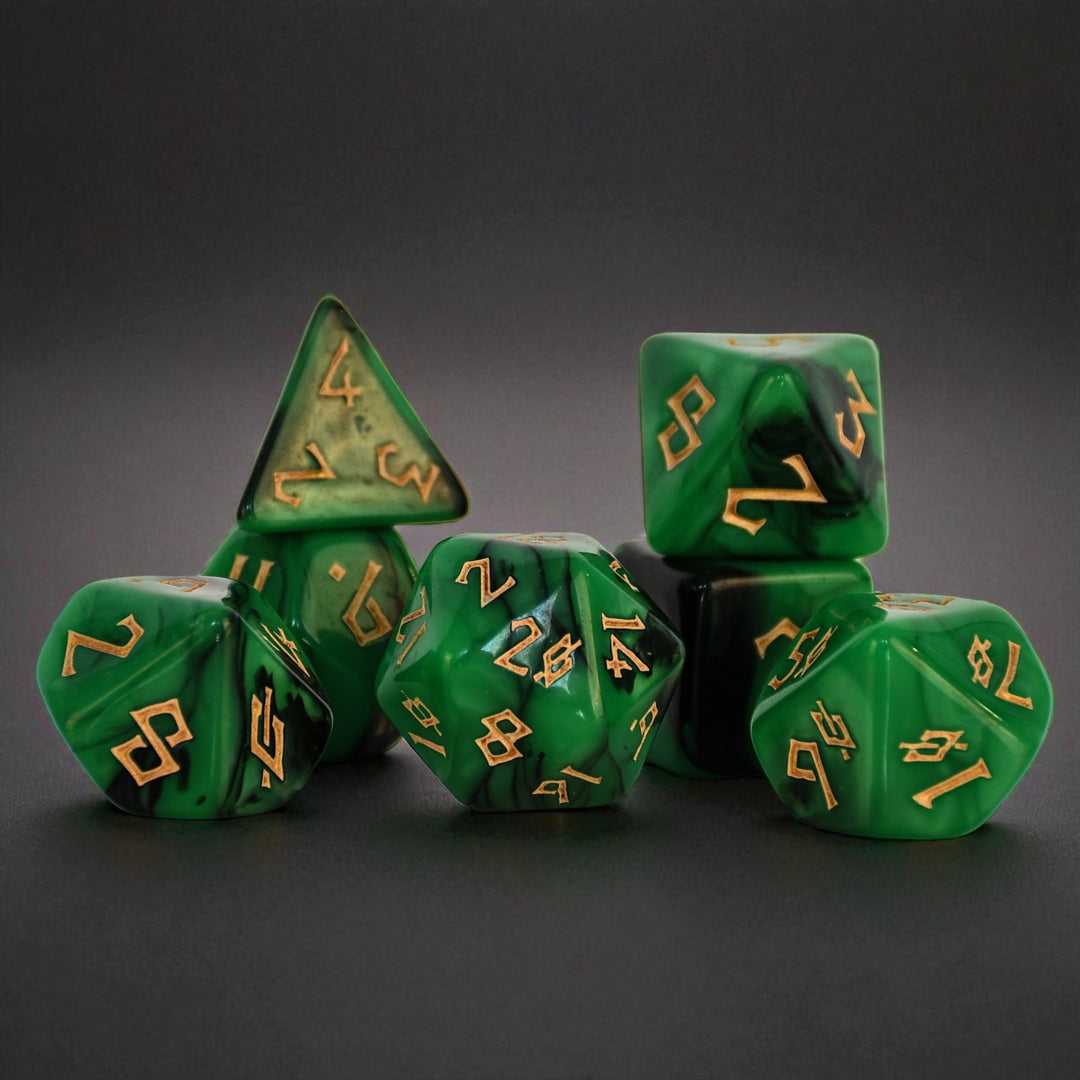a set of green acrylic dice with black swirls and gold numbering for gaming