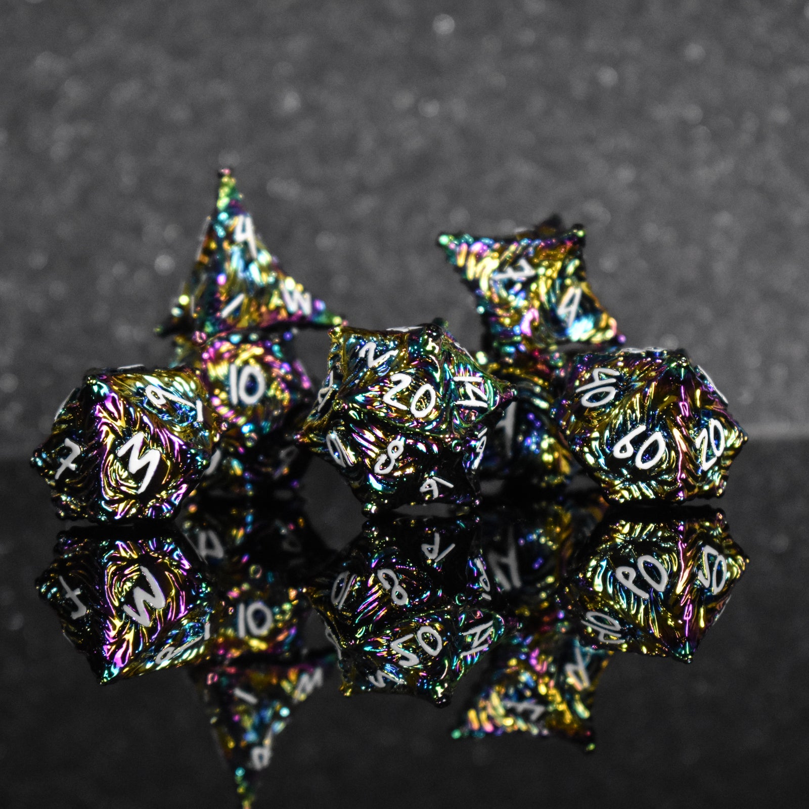 Iridescent metal dice with vortex swirls and a white font
